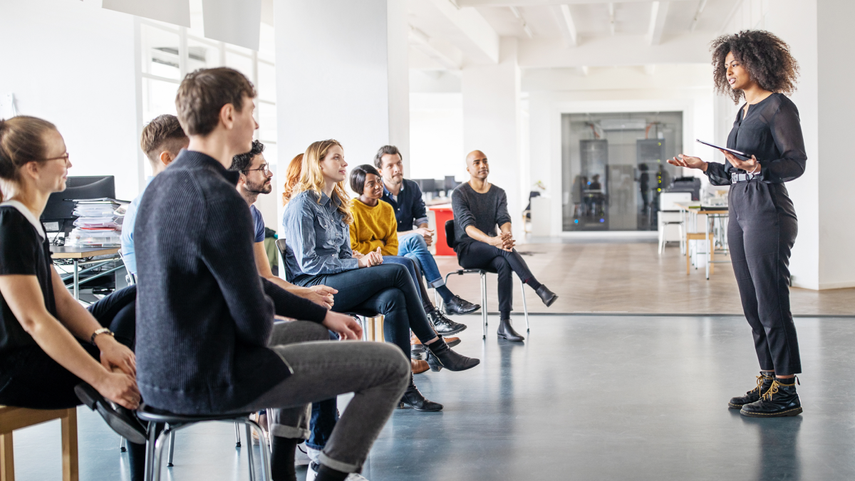 Employees gathered together to hear a presenter